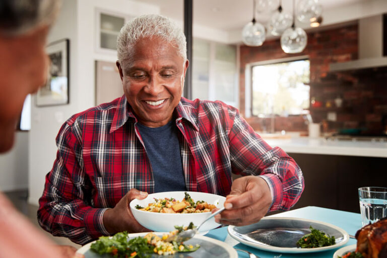 Dental Implant Patient Eating Happily