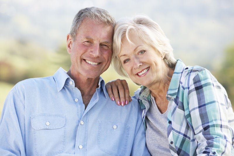 Dental Implant Patients Smiling After Their Dental Procedures