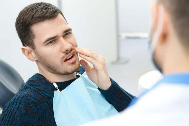 Dental Patient Suffering From Dental Pain On The Dental Chair