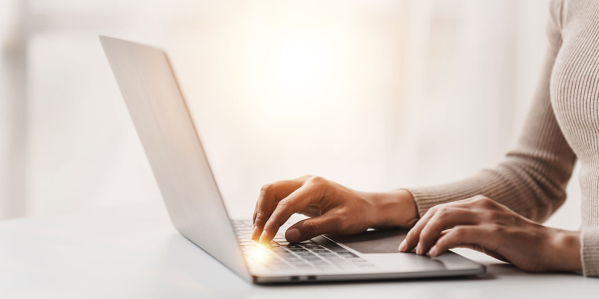 woman using computer to read dental blogs